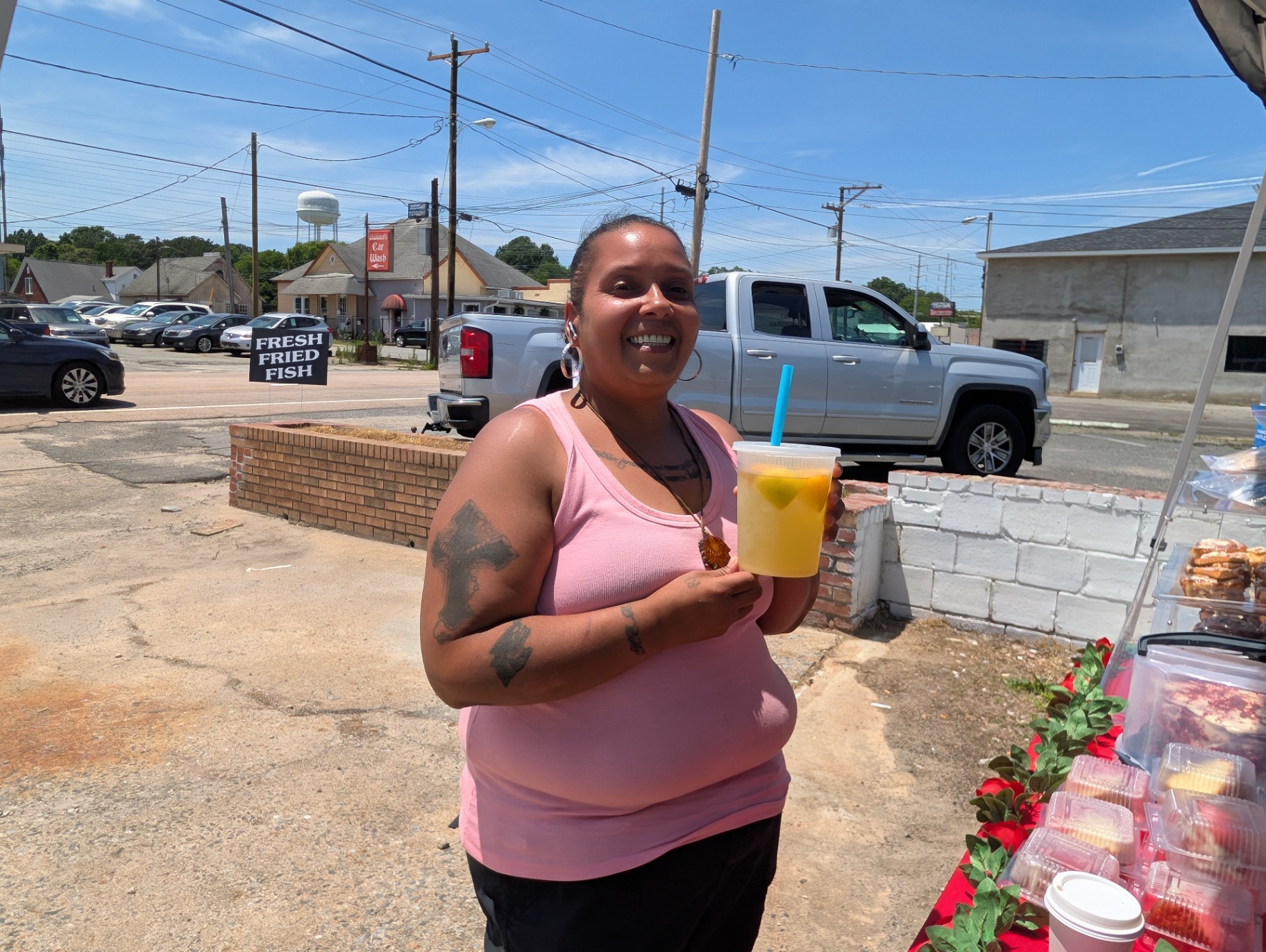 Customer enjoying a fresh drink outside the shop