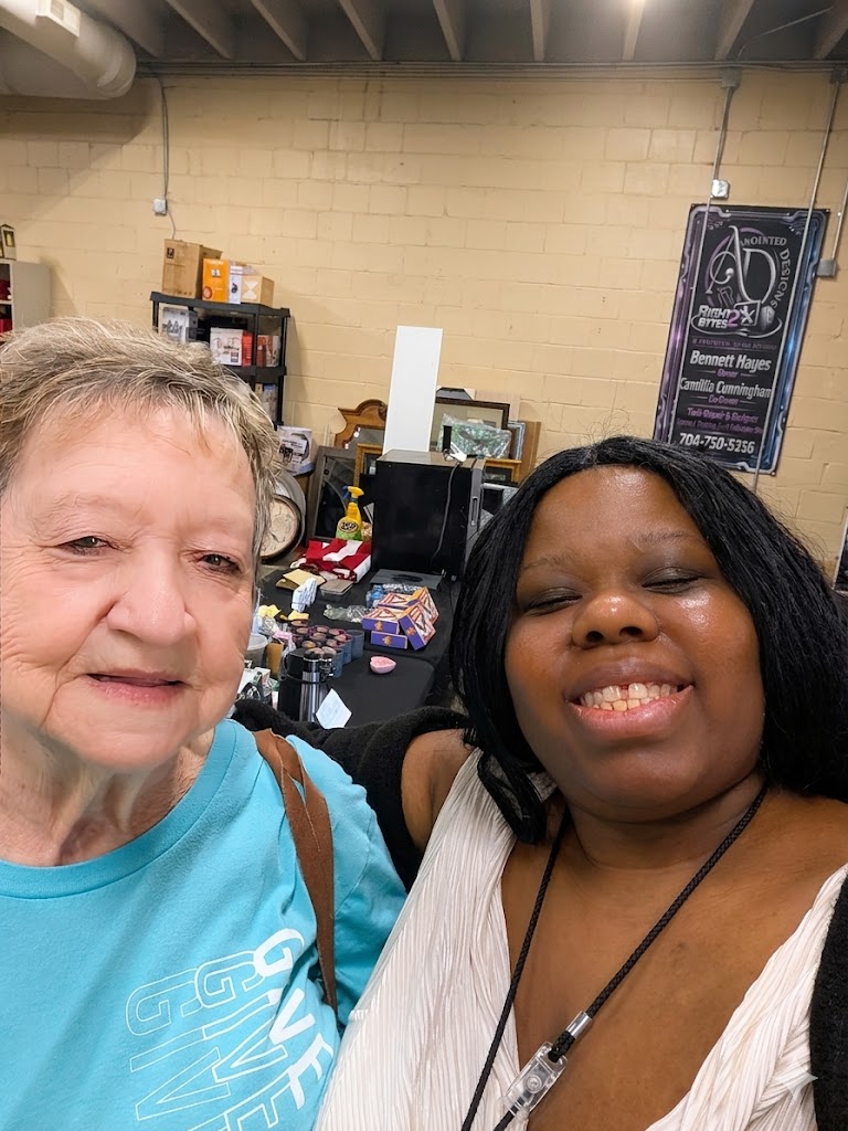 Happy customers smiling together at South Main Marketplace